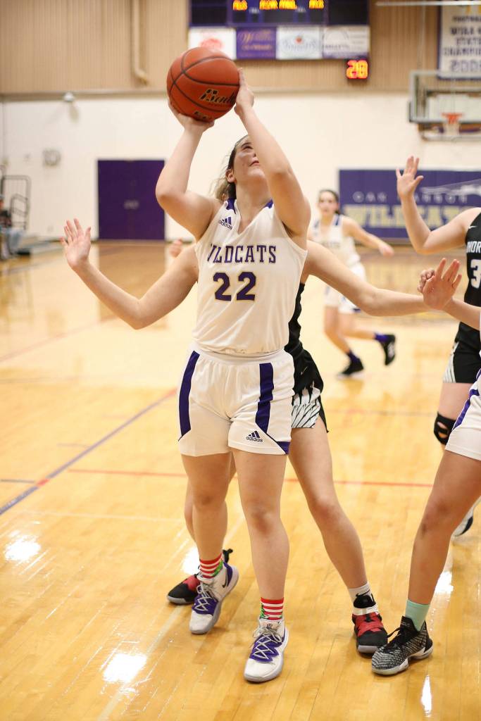 Paige Fortin puts up a shot for Oak Harbor.(Photo by John Fisken)