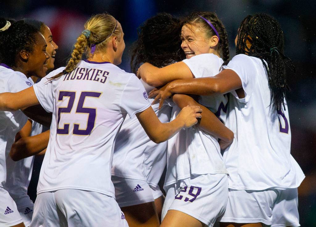 University of Washingtons Mary Johnston (second from right), an Oak Harbor graduate, celebrates her goal against second-ranked North Carolina. (Photo courtesy of UW Athletics)