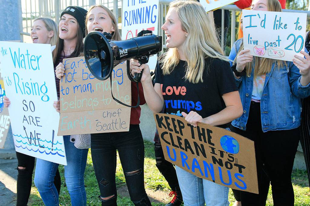 Students lead a chant at a climate strike in Coupeville. The event joined hundreds like it across the globe in an effort. File photo by Laura Guido/ Whidbey News-Times