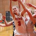 Chelsea Prescott fights a crowd for a rebound.(Photo by John Fisken)