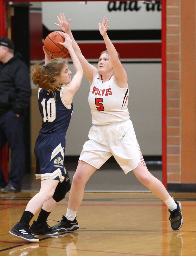 Audrianna Shaw defends Cedar Park Christians Skye Bonner (10).(Photo by John Fisken)