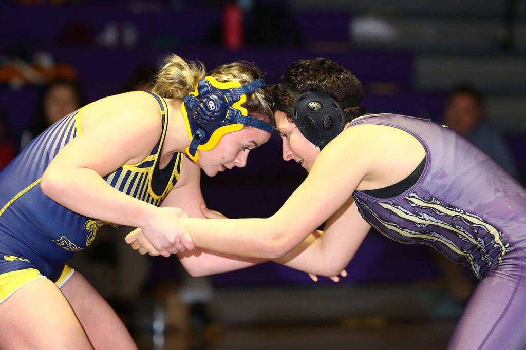 Wildcat Taylor Cress, right, squares off with her Burlington-Edisons Natalie Albright.(Photo by John Fisken)