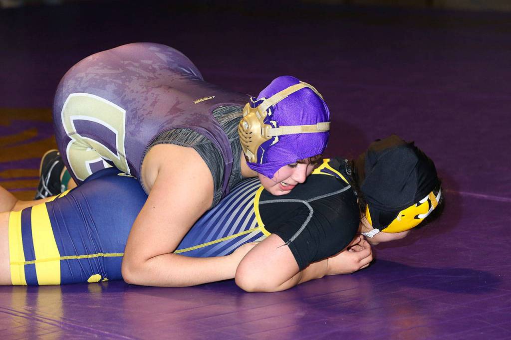 Oak Harbors Gabi Suarez-Flores, top, wins an exhibition match with Burlingtons Natalie Alatorre.(Photo by John Fisken)
