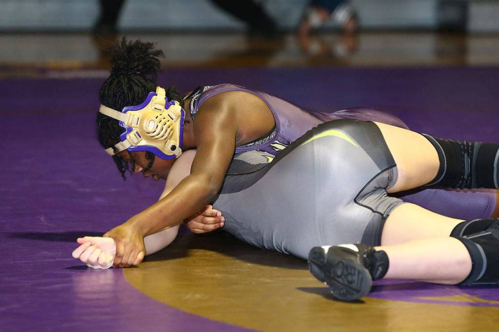 Wildcat Christina Frank, top, turns her Lynden opponent.(Photo by John Fisken)