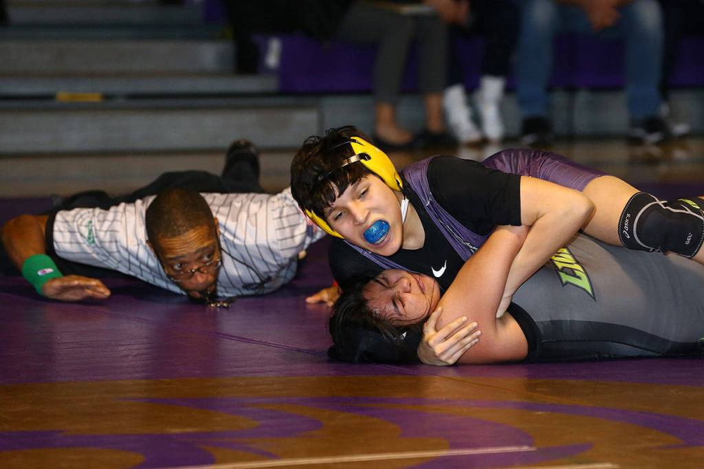 Adelina Lopez, top, records a third-round pin against Lynden.(Photo by John Fisken)