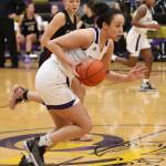 Jasmine Ford hustles the ball up the floor for Oak Harbor.(Photo by John Fisken)