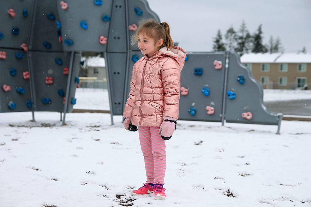 Hillcrest Elementary Kindergartner Ashton Lefler enjoys the wintery weather that hit Whidbey on Monday morning.