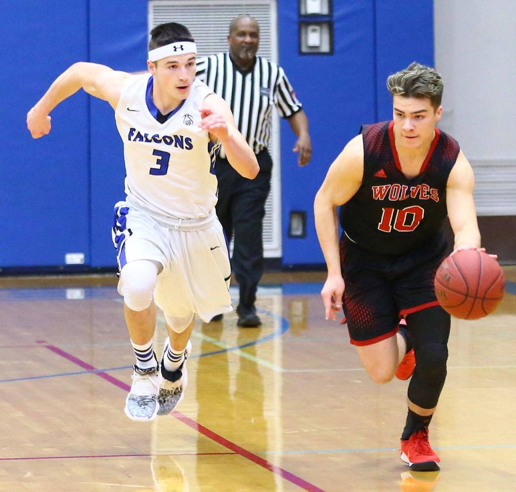 Coupevilles Sean Toomey-Stout, right, races by the Falcons Dexter Jokinen.(Photo by John Fisken)