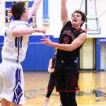 Coupevilles Koa Davison, right, flips a shot over South Whidbeys Sterling Patton.(Photo by John Fisken)