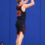 Gavin Knoblich launches a three-point shot. (Photo by John Fisken)