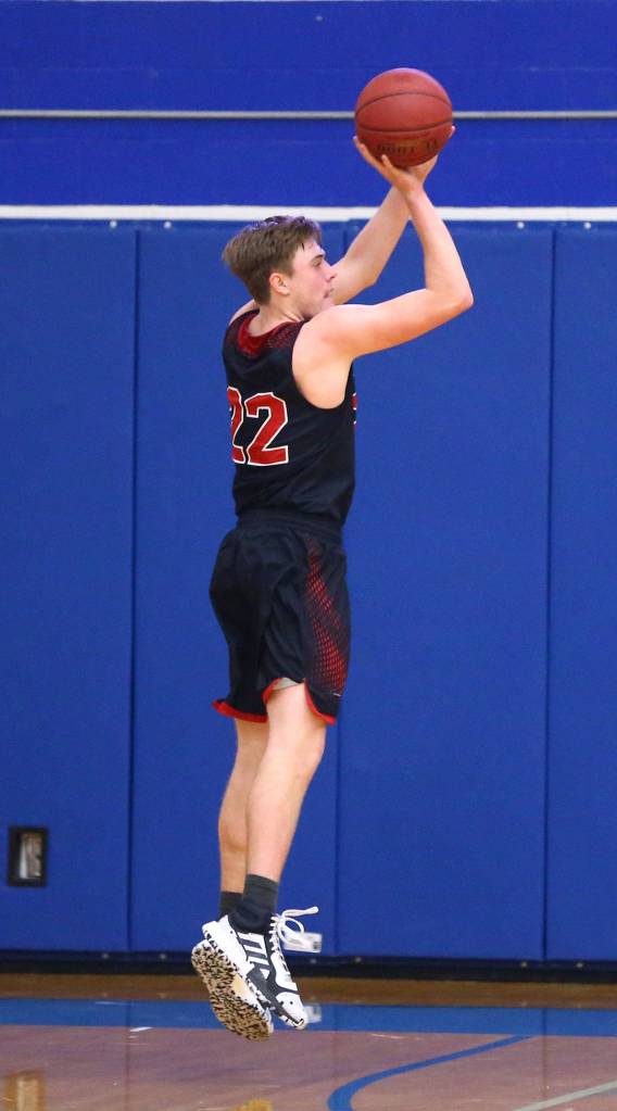 Gavin Knoblich launches a three-point shot. (Photo by John Fisken)