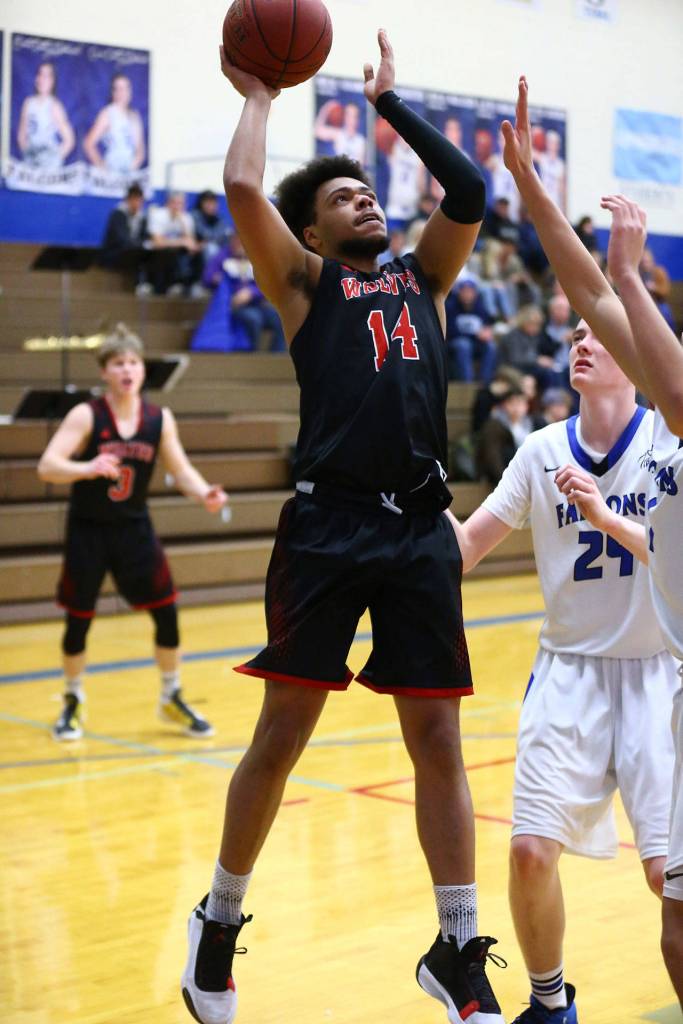 Jacobi Pilgrim shots in the Wolves game at South Whidbey Friday.(Photo by John Fisken)