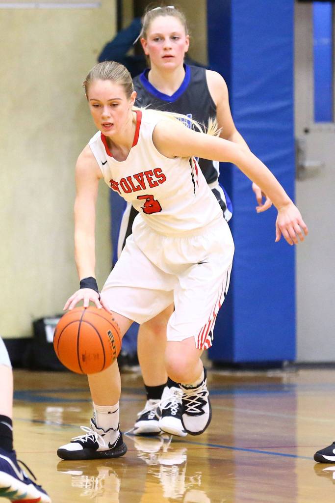 Chelsea Prescott begins to bring the ball up the floor for the Wolves.(Photo by John Fisken)