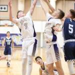 Oak Harbors Will Rankin, left, and Brock Boyer battle for a rebound against Meadowdale.(Photo by John Fisken)