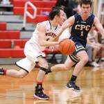 Coupevilles Jered Brown tries to get around Cedar Park Christians Matthew Duffy (1). (Photo by John Fisken)