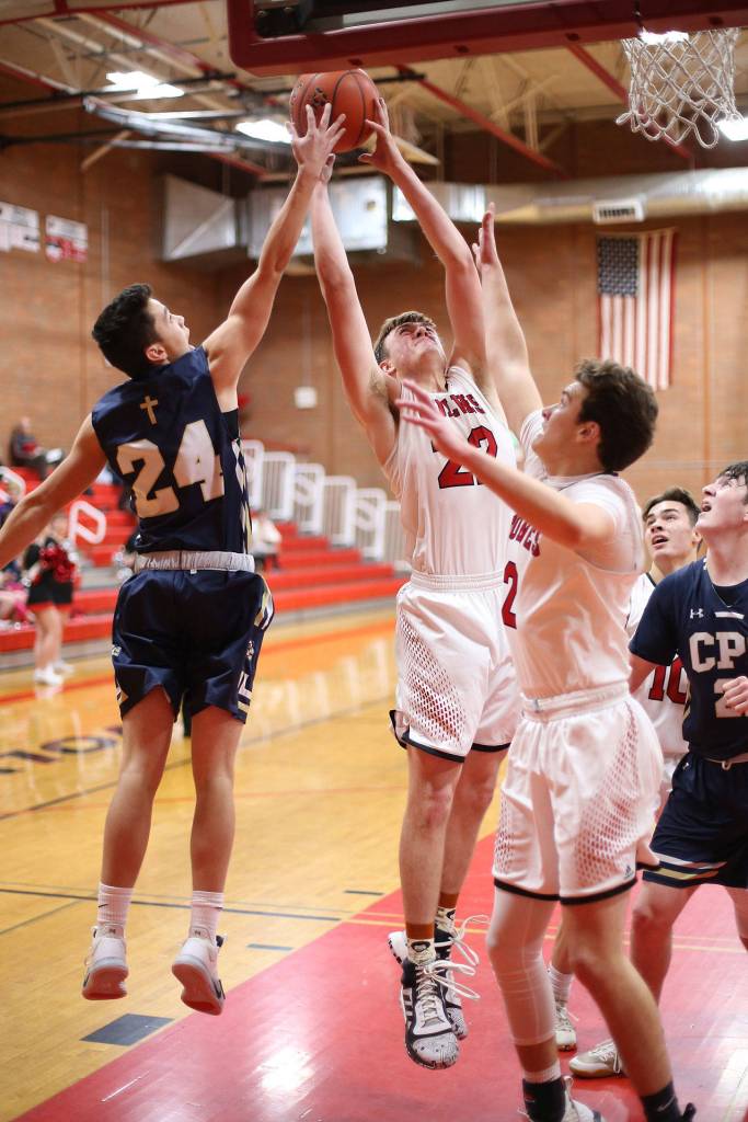 Gavin Knoblich snatches a rebound from the Eagles Jack Allen (24).(Photo by John Fisken)