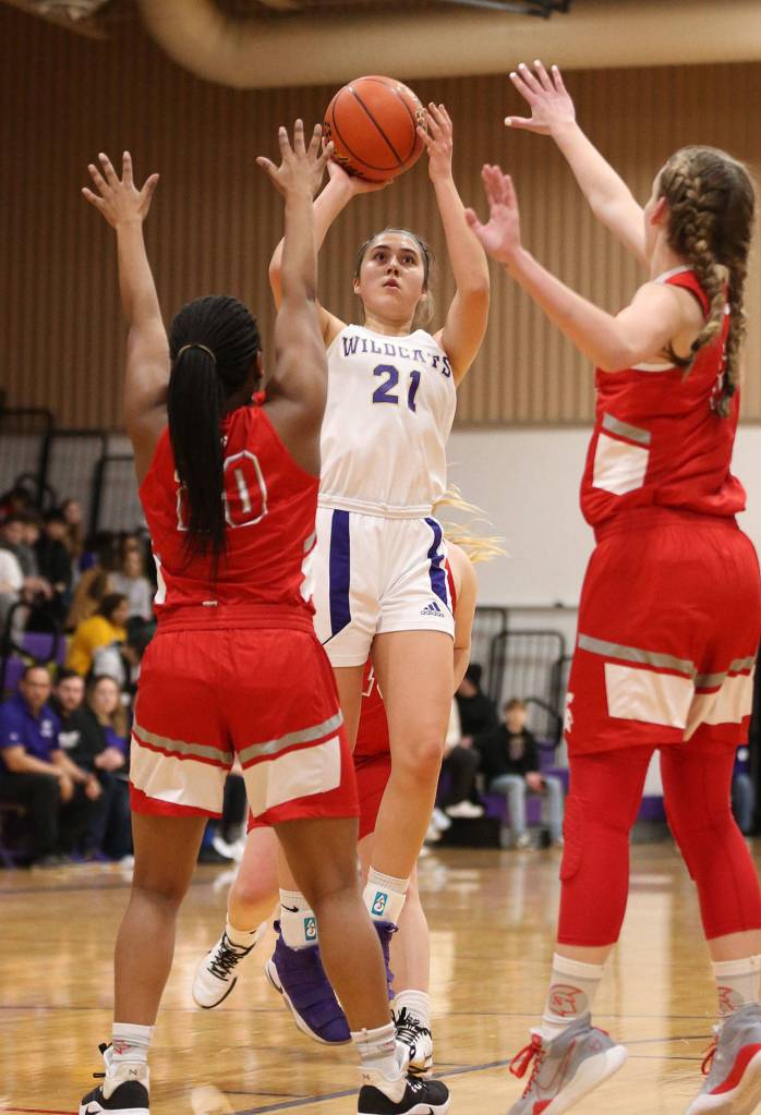 Mikhaela Cortez (21) shots over the Stanwood defense. (Photo by John Fisken)