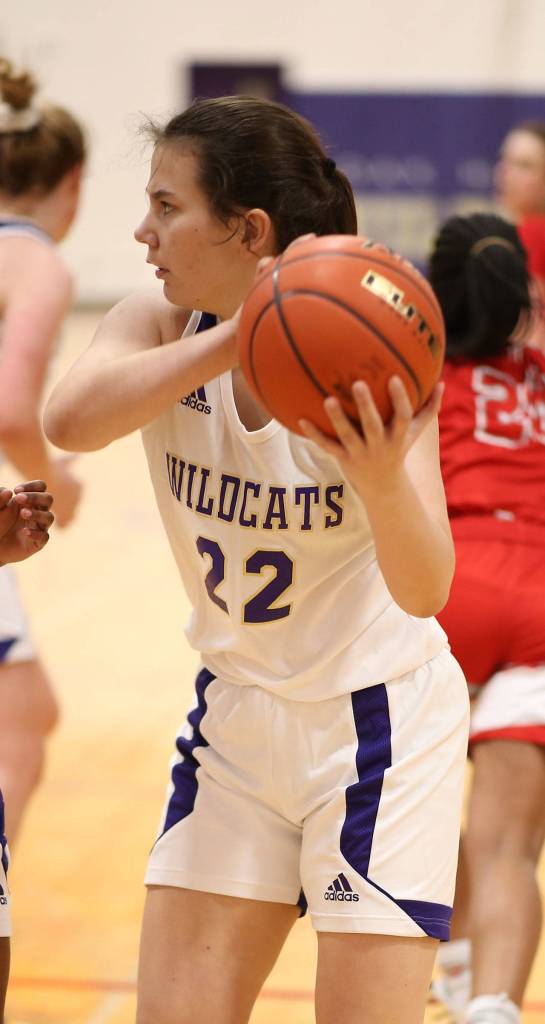 Paige Fortin clears a rebound for Oak Harbor.(Photo by John Fisken)