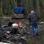 Photo by Laura Guido/Whidbey News-Times                                Dennis Phillips, of Island County Human Services, walks through a known encampment on North Whidbey during the annual Point in Time count of homeless people.