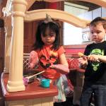 Photo by Laura Guido/Whidbey News-Times                                Kara Pelzel, 3, and Ethan Boswell, 4, toil away in the kitchen space at Oak Harbor Playtown.
