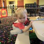 Photo by Laura Guido/Whidbey News-Times                                Nathanial Mildener, 15 months, stays busy at Oak Harbor Playtown.
