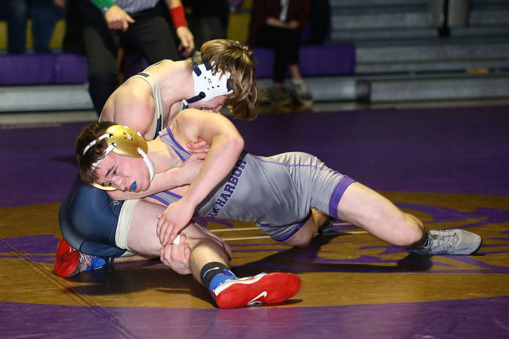 Oak Harbors Tim Powers, front, tries to put Cole Phillips on his back.(Photo by John Fisken)