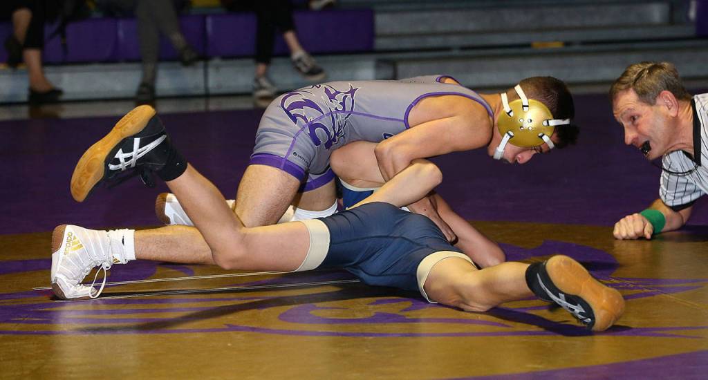 Wildcat Derek Salazar-Leyva attempts to turn Alexander Dorchak.(Photo by John Fisken)
