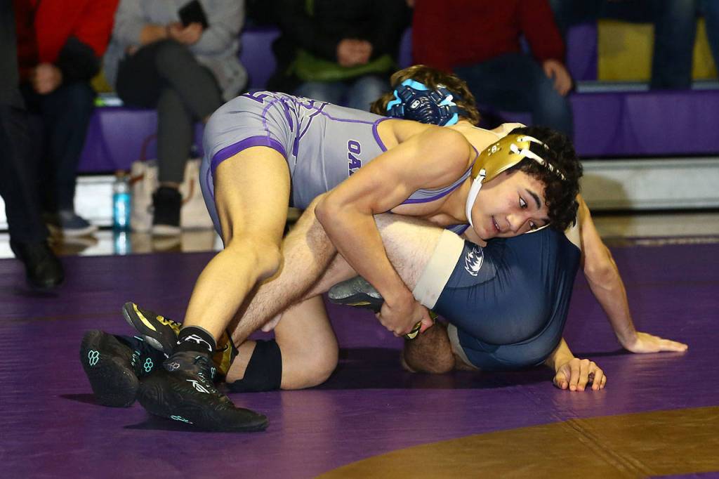 Oak Harbors Cole Valdez, front, tries to take control of Dorian Tollenaar.(Photo by John Fisken)
