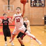 Sean Toomey-Stout flies to the hoop for the Wolves.(Photo by John Fisken)