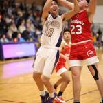 Matt Kelley (10) flies by M-Ps Cameron Stordahl.(Photo by John Fisken)