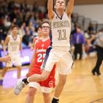 Oak Harbors Garrett Levell scores on a fast break.(Photo by John Fisken)