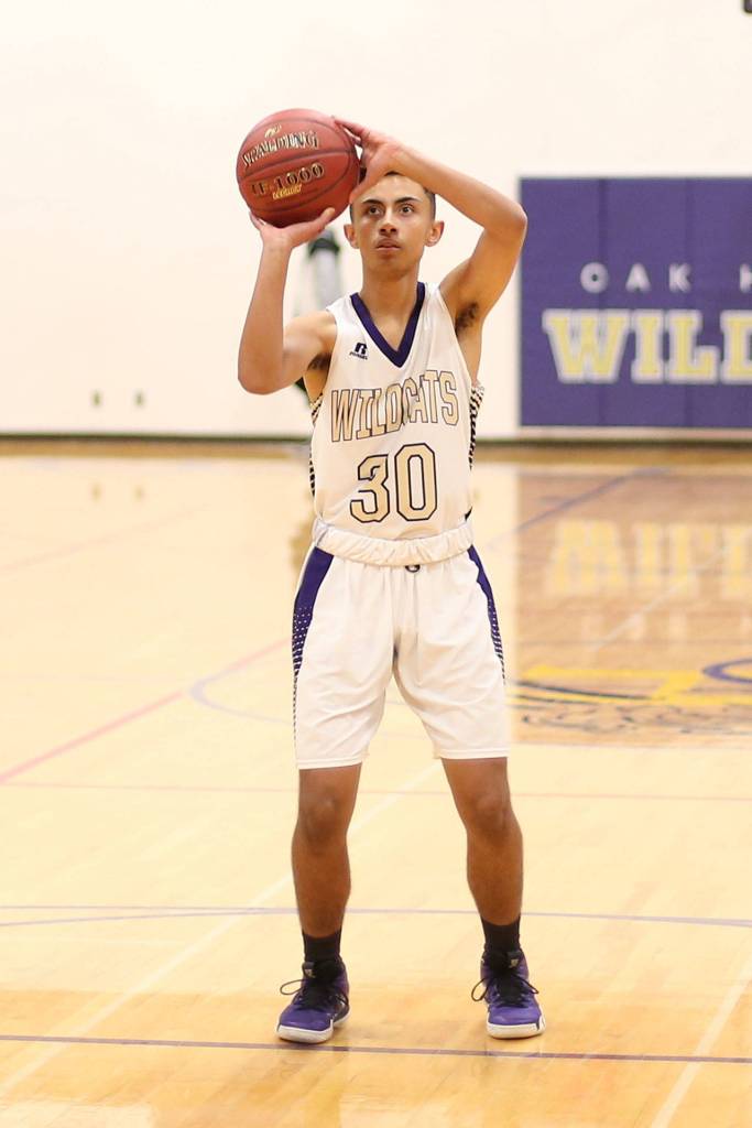 Josh Pendleton sinks a free throw for Oak Harbor.(Photo by John Fisken)