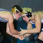 Oak Harbors Evan Beerbower, left, tangles with Anacortes Aidan Ufkes. (Photo by John Fisken)