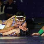 Oak Harbors Derek Salazar-Leyva, top, records a fall over Anacortes Erik Guzman in Fridays match.(Photo by John Fisken)