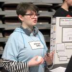 Grace Weatherford talks about The Devils Arithmetic, a novel about a Jewish girl living in New York who is sent back in time to experience the Holocaust. Coupeville eighth graders held a book exhibit event Monday to commemorate Holocaust Remembrance Day. Photo by Laura Guido/Whidbey News-Times