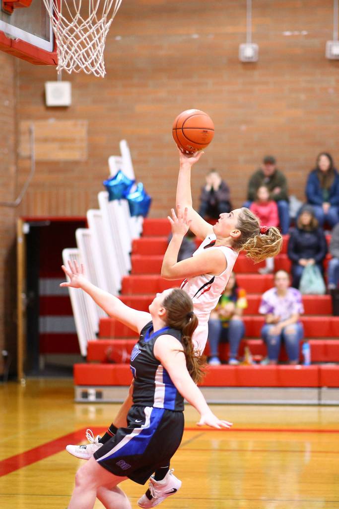 Tia Wurzrainer scores on a fast break for Coupeville.(Photo by John Fisken)