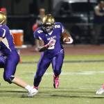Princeton Lollar, shown here rushing for Oak Harbor in 2016, signed a letter of intent to play football for UNLV. (Photo by John Fisken)