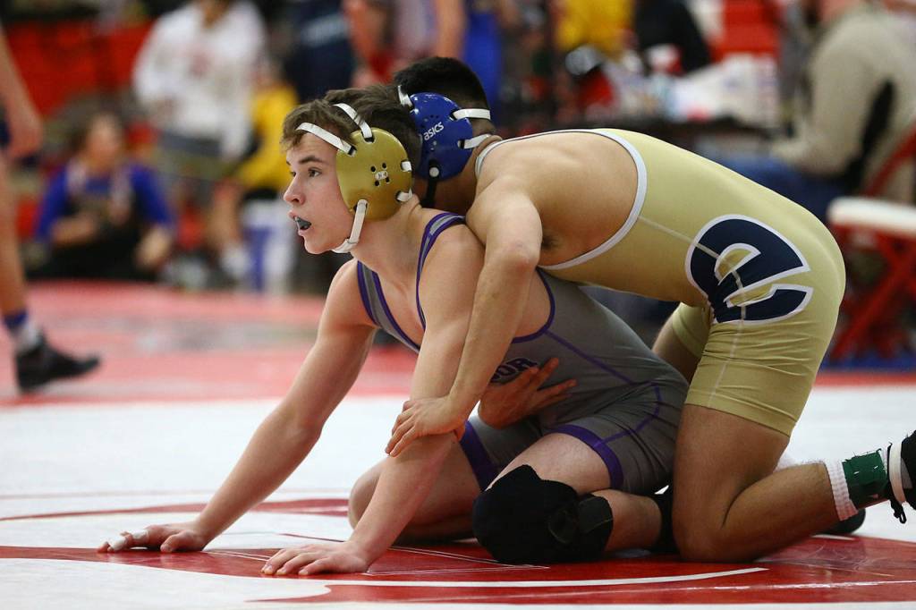 Timothy Powers, left, gets ready to start a round. (Photo by John Fisken)