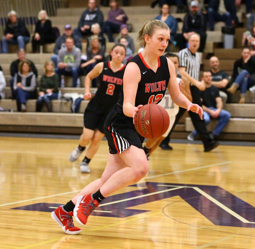 Anya Leavell leads the fast break. (Photo by John Fisken)