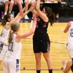 Carolyn Lhamon shoots over the Nooksack Valley defense. (Photo by John Fisken)