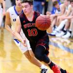 Sean Toomey-Stout attacks the hoop in this past basketball season. (Photo by John Fisken)