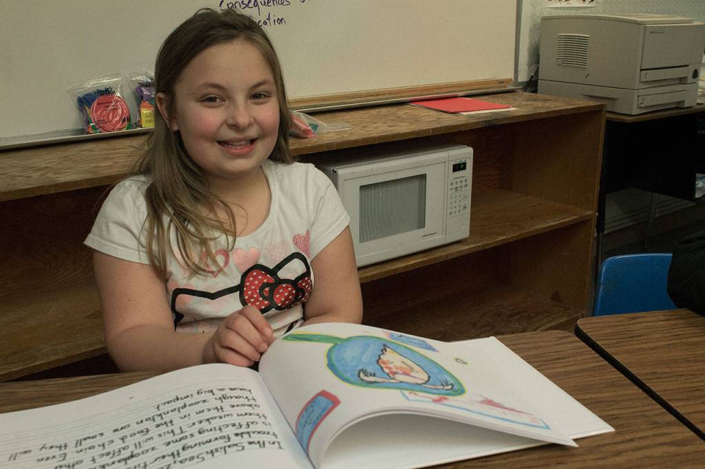 Photo by Brandon Taylor/Whidbey News-Times                                Kamie Chesser, 9, used her friends markers to color her picture of zooplankton.