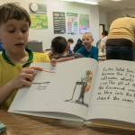 Photo by Brandon Taylor/Whidbey News-Times                                David Scheer, 9, points to a graph depicting the change in saltwater acidification based on an experiment the class conducted.