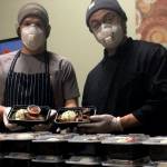 David Krolokouski and Juan Zalapa, right, prepare meals every Sunday in the kitchen of Pickles Deli in Clinton.