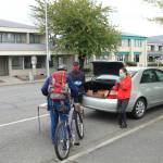 Justin Santos and Kyla Rose, interns with Living Word, hand out a sack meal while volunteering with SPIN Cafe.