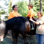 Photos by Kira Erickson/Whidbey News-Times                                The Cerrato family with Arabella, a rare full-grown Dales pony. From left to right, George, Viggo and Shuna.
