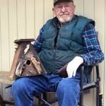 Lions member building birdhouses to help food bank