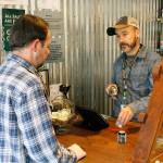 Photo by Kira Erickson/Whidbey News-Times                                Budtender Tyler Small helps a customer with a purchase at Island Herb.