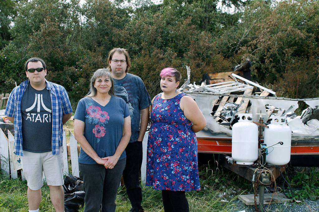 Photo by Kira Erickson/Whidbey News Group                                Donna DeBonis and her household rushed outside to help Angela Kurtz when they heard the explosion the night of Friday, June 5. From left to right: housemate Matt Salazar, Donna DeBonis, her son Daniel Cadwell and daughter Diana Cadwell.