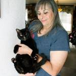Photo by Kira Erickson/Whidbey News Group                                Donna DeBonis with Talyn, Angela Kurtzs cat that survived the blast with singed fur.